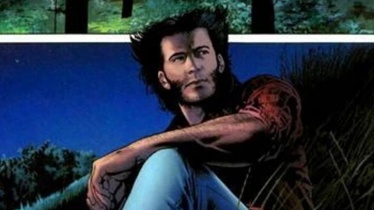 Comics Wolverine, in a red shirt and blue jeans, looking to the side while sitting down. 